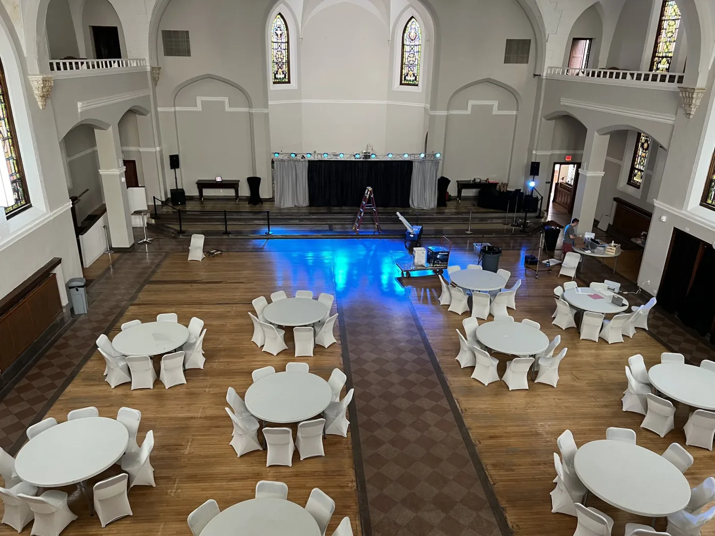 Dresden Castle from the balcony, with round reception tables and a blue-lit dance floor
