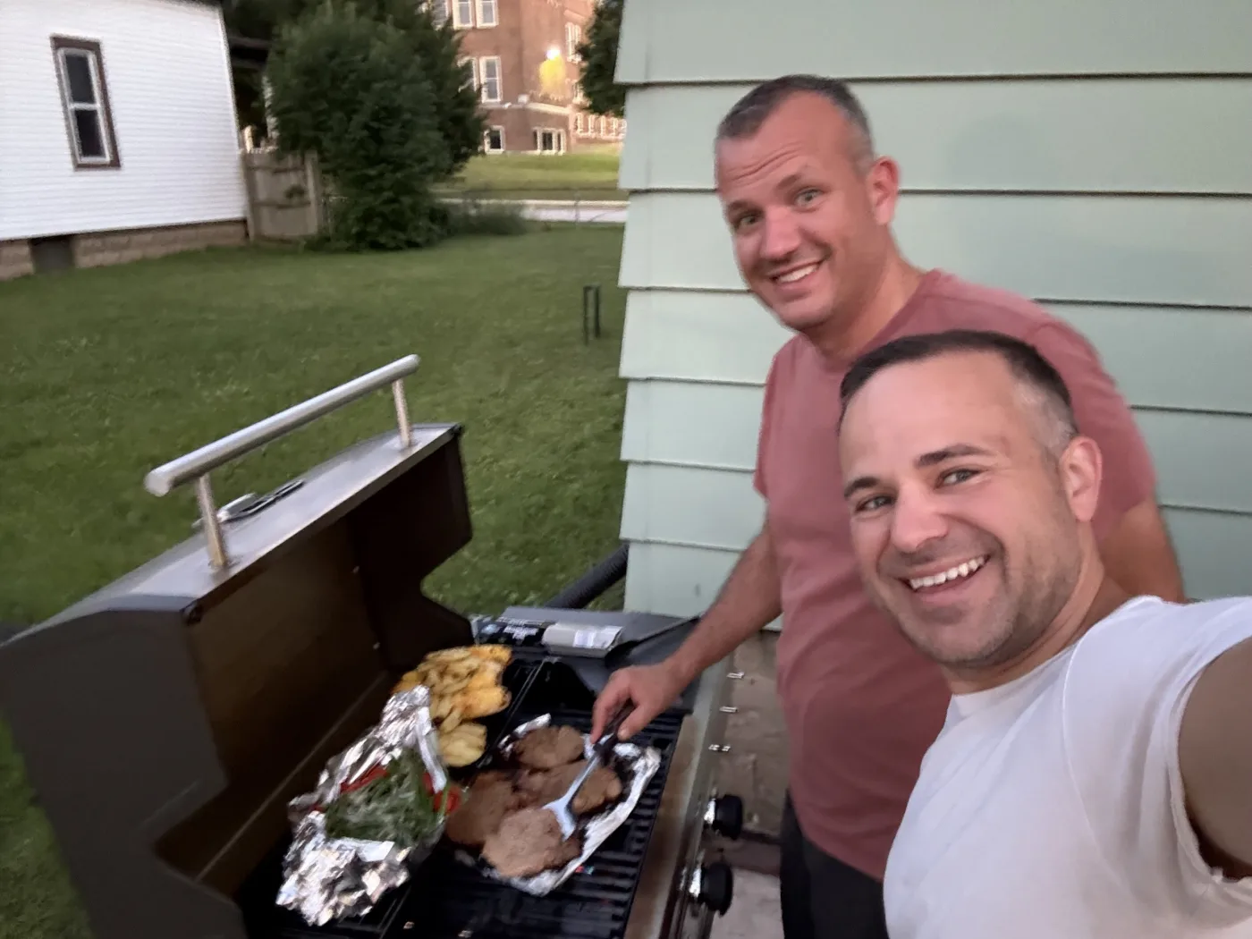 Alex and Jason cooking at the grill