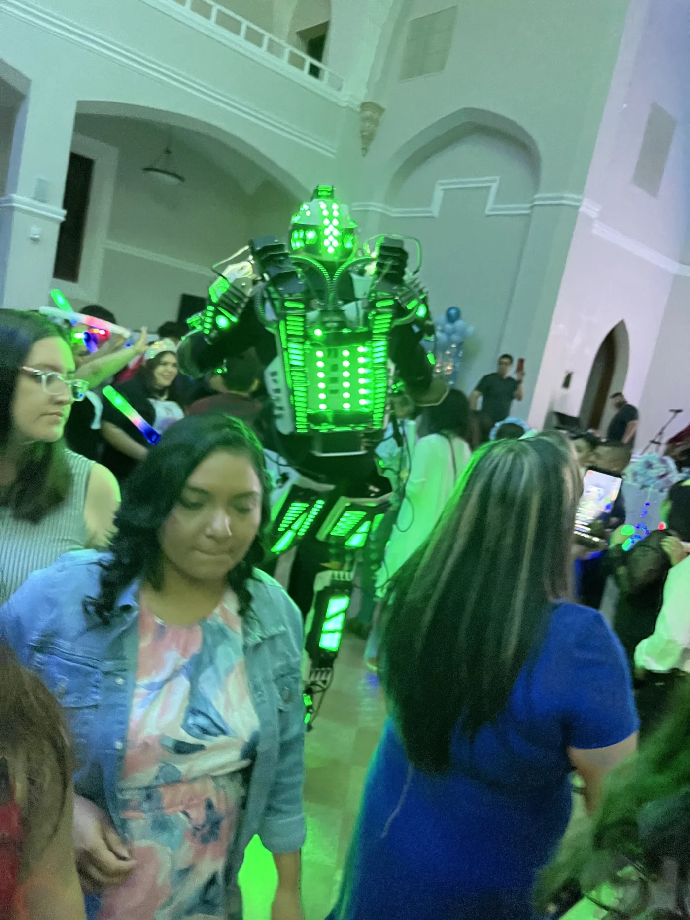 Mr. Roboto in an LED suit with guests on the dance floor